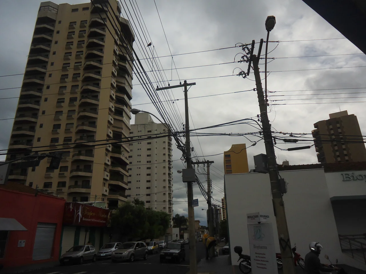 Urban landscape from Uberlândias's downtown in Minas Gerais, Brazil. Picture taken at the beginning of the twilight with the presence of the full moon